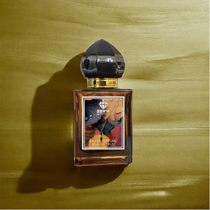 BBWW SCENTIQUE LV Ombre Nomade fragrance bottle on rock with mountain landscape background